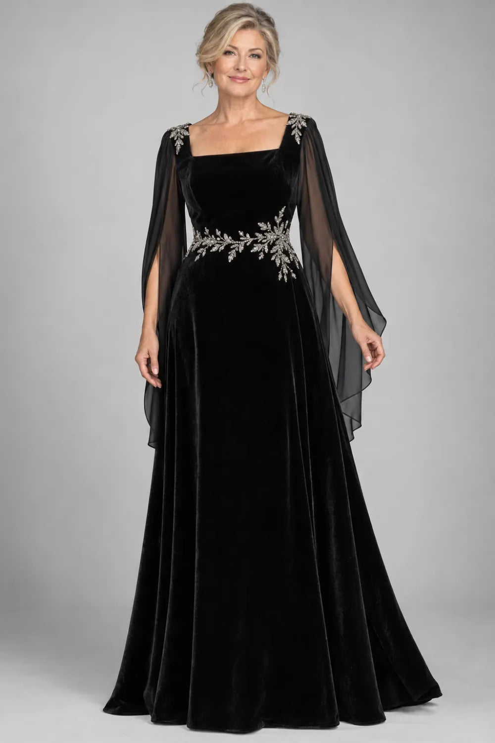 Black dress with silver-tone leafy waist and shoulder accents, front view.
