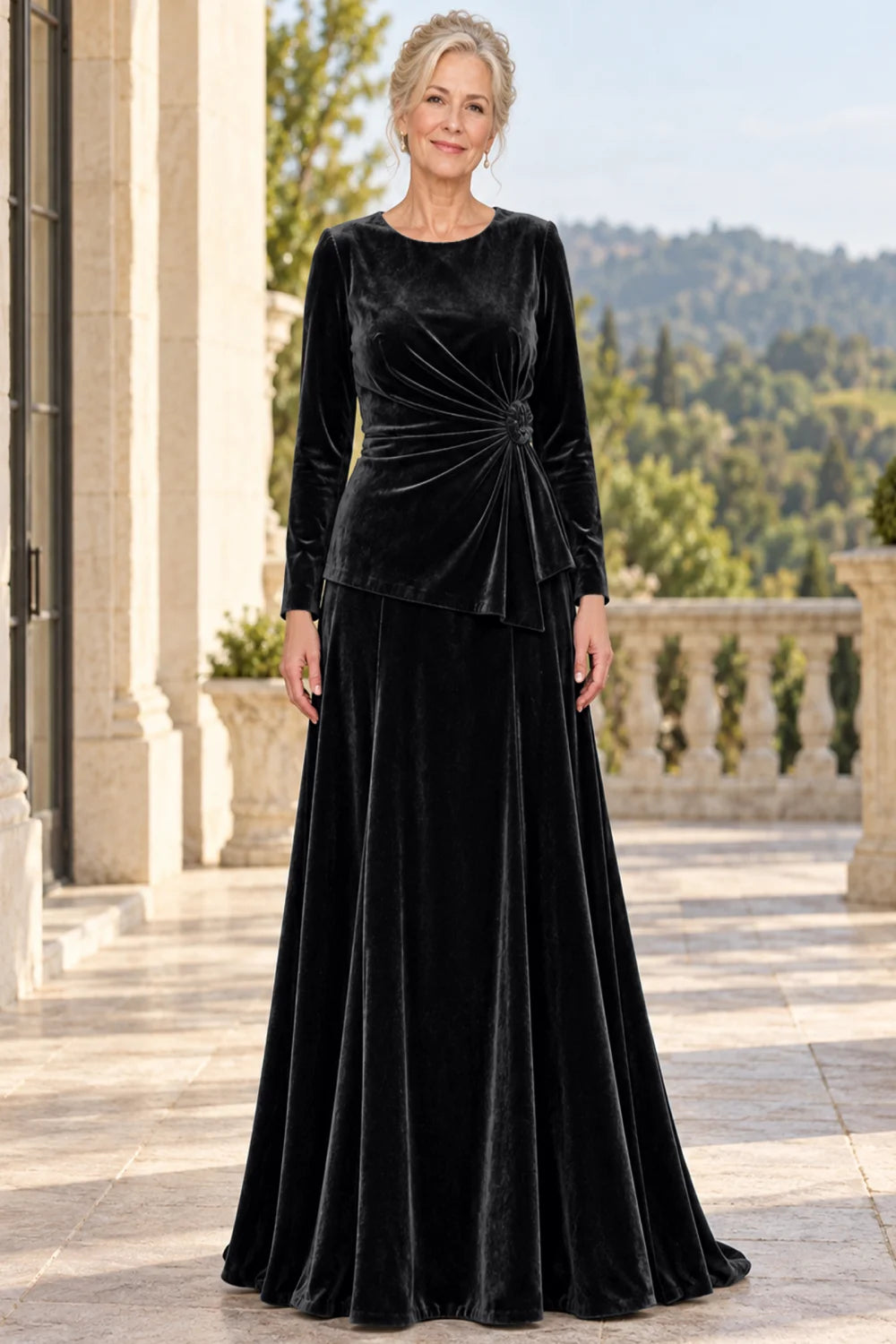 Front view of a black dress with a ruched front and side rosette.