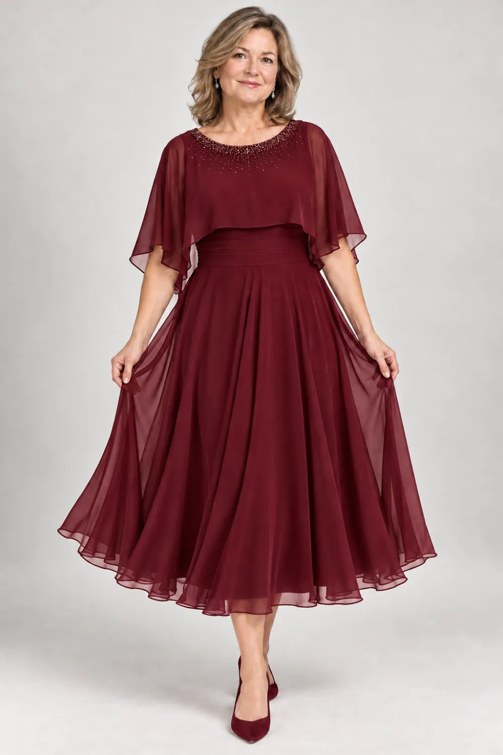 Burgundy dress with narrow beaded neckline and defined waist, front view.