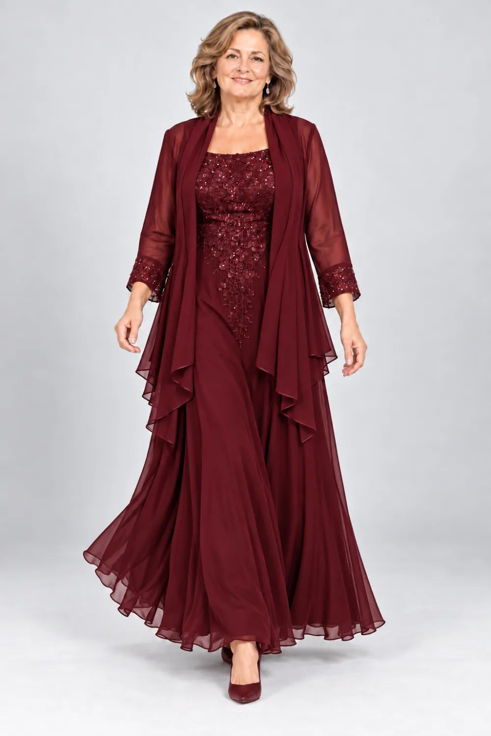 Burgundy dress with floral bodice and matching decorated cuffs, front view.