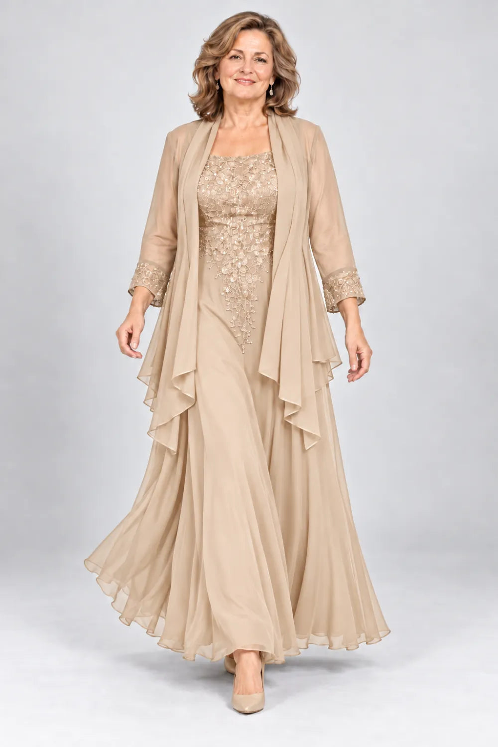 Champagne dress with floral bodice and matching decorated cuffs, front view.