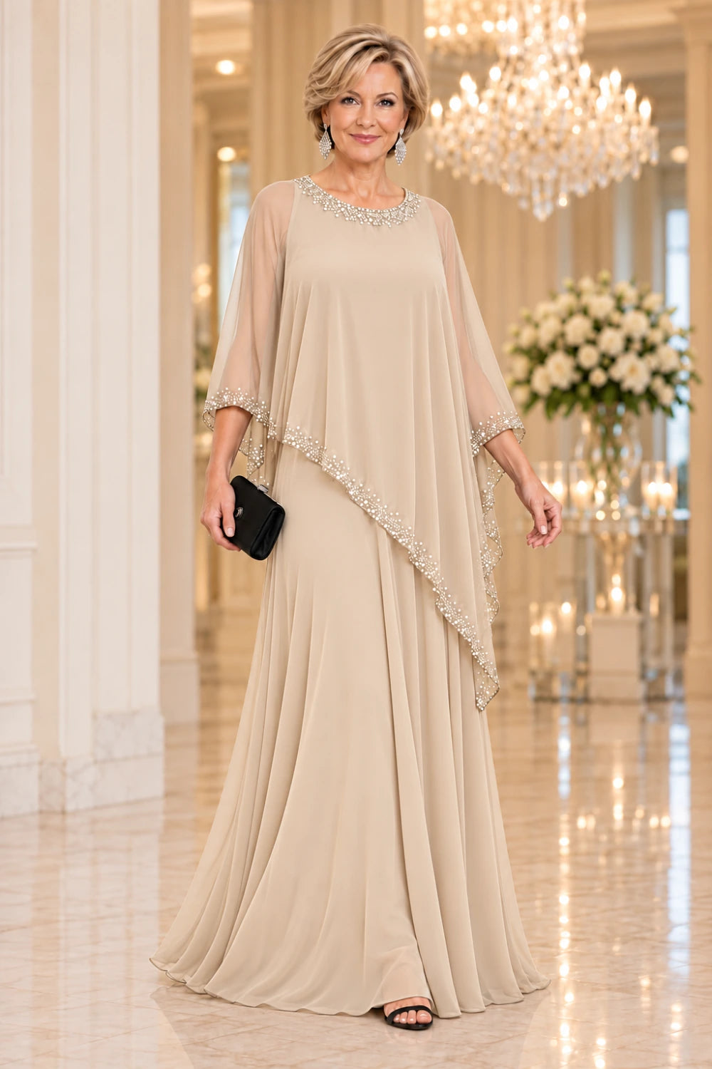 Champagne floor-length dress with a decorated round neckline and pointed waterfall cape, front view.