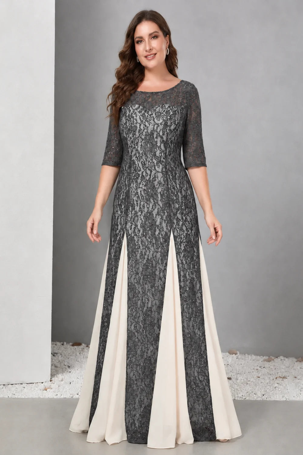 Front view of a charcoal gray dress with lace and contrasting pale skirt panels.