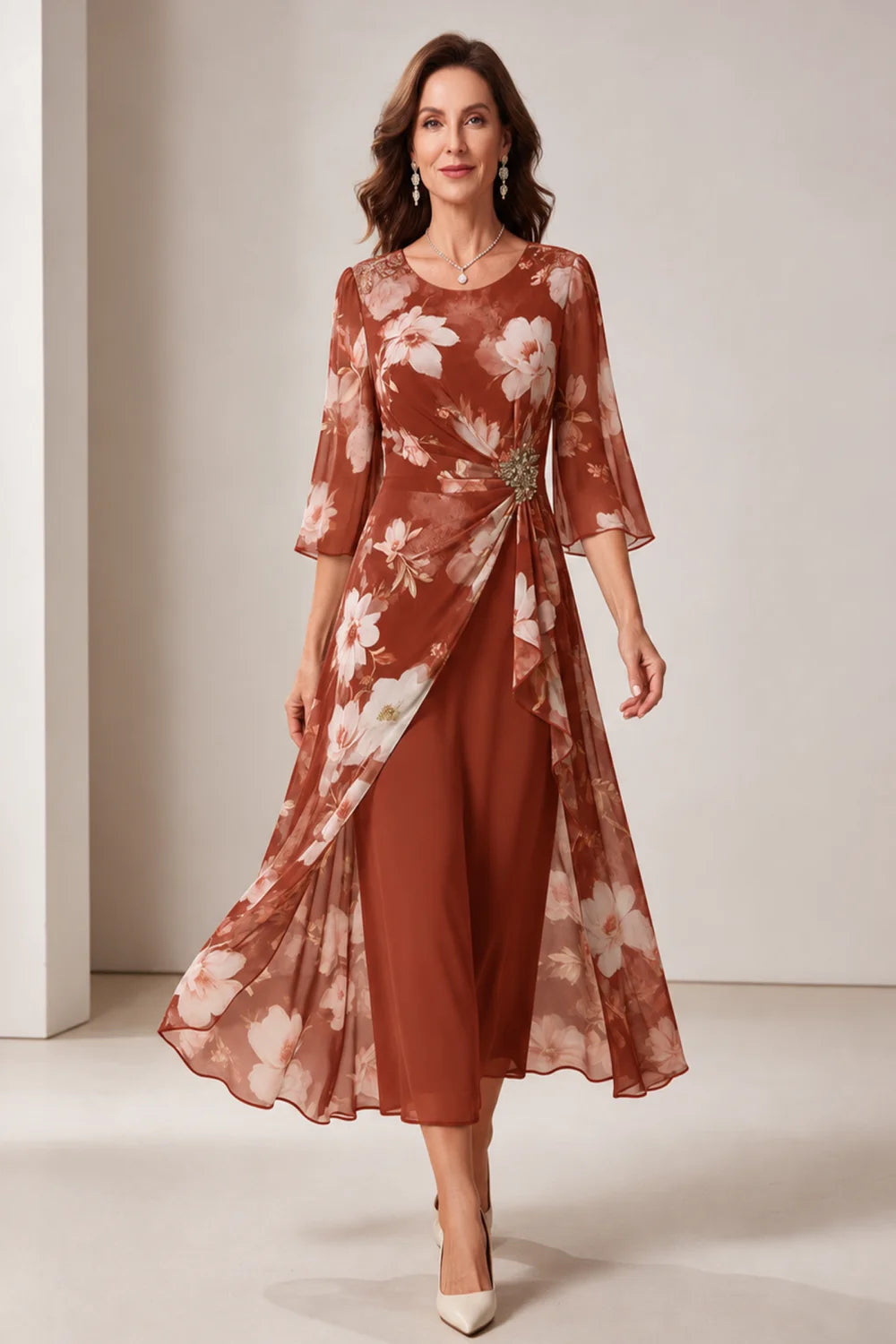 Front view of a copper dress with a floral overlay and flared sleeves.