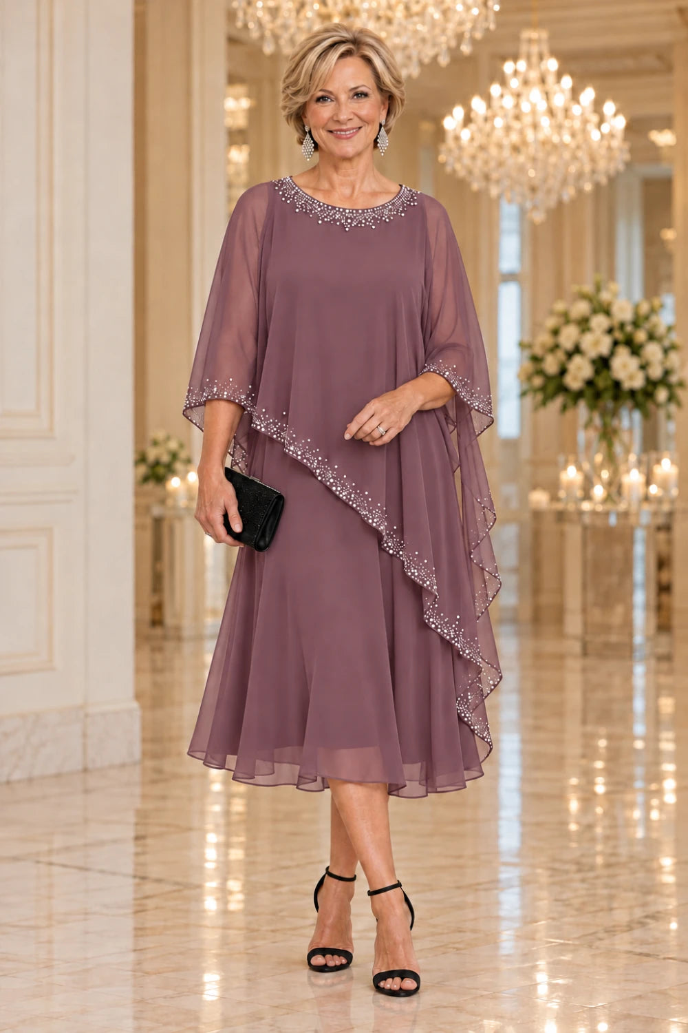 Dusty mauve dress with a sheer diagonal cape and plain below-knee skirt, front view.