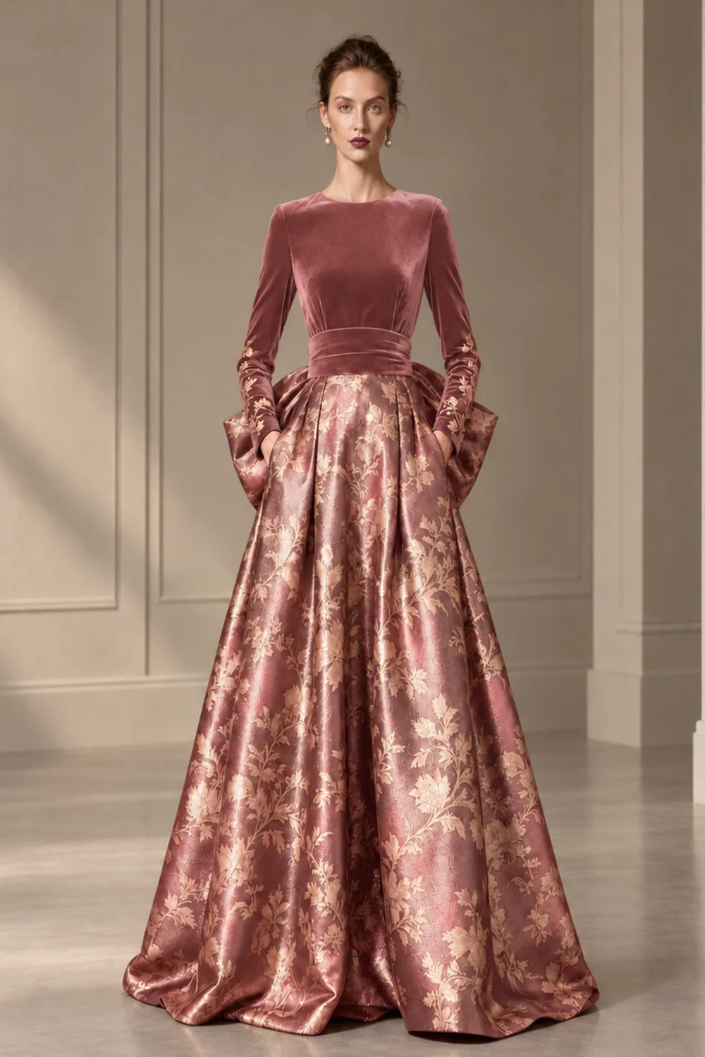 Front view of a dusty rose dress with a dark bodice and a full floral skirt.