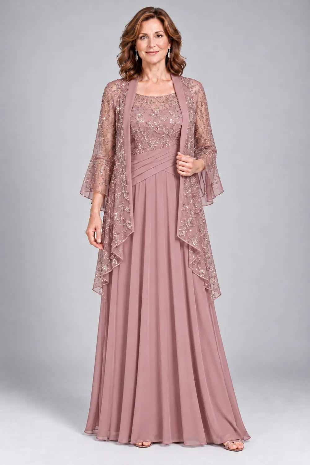 Dusty Rose dress with floral decorated bodice and diagonal gathered waist, front view.