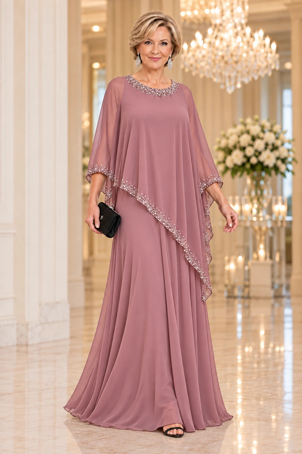 Dusty rose floor-length gown with bright round-neck trim and dotted cape edging, front view.