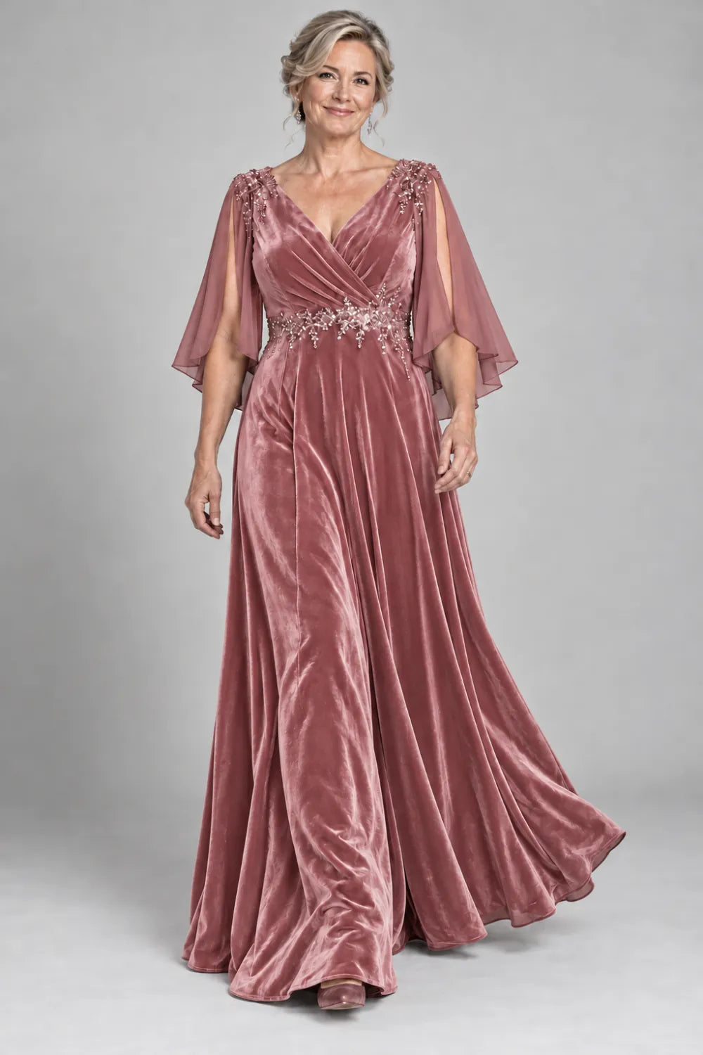 Dusty Rose dress with crossover bodice and decorated waist, front view.