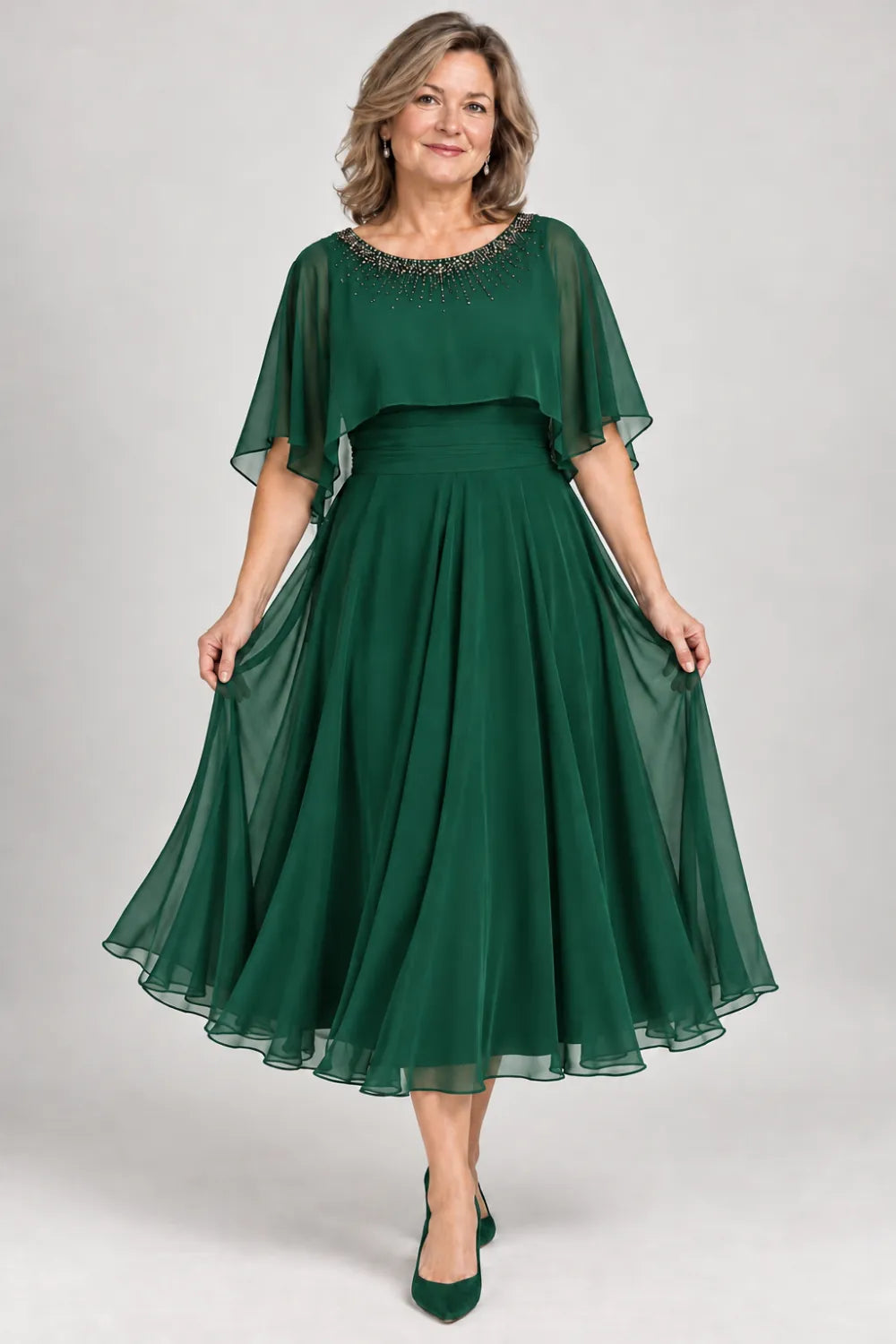 Emerald Green dress with narrow beaded neckline and defined waist, front view.