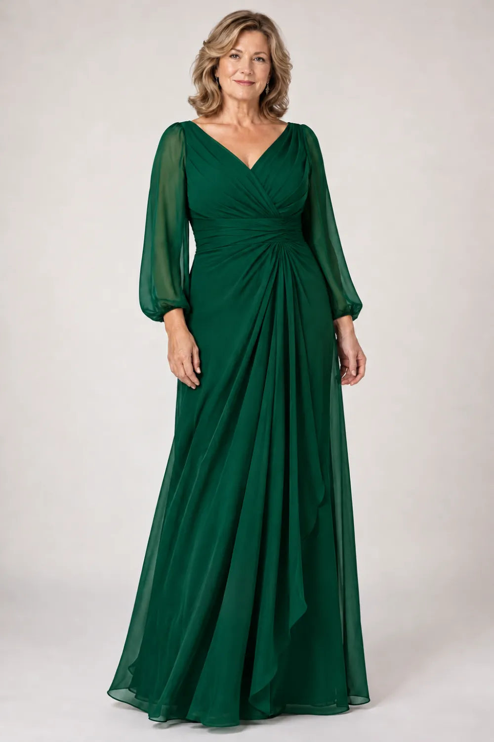 Emerald Green dress with crossover bodice, gathered waist and cascading side panel, front view.