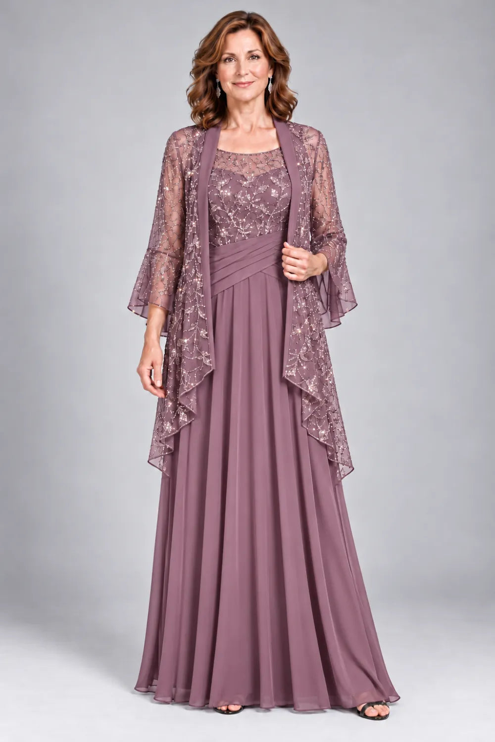 Mauve dress with floral decorated bodice and diagonal gathered waist, front view.