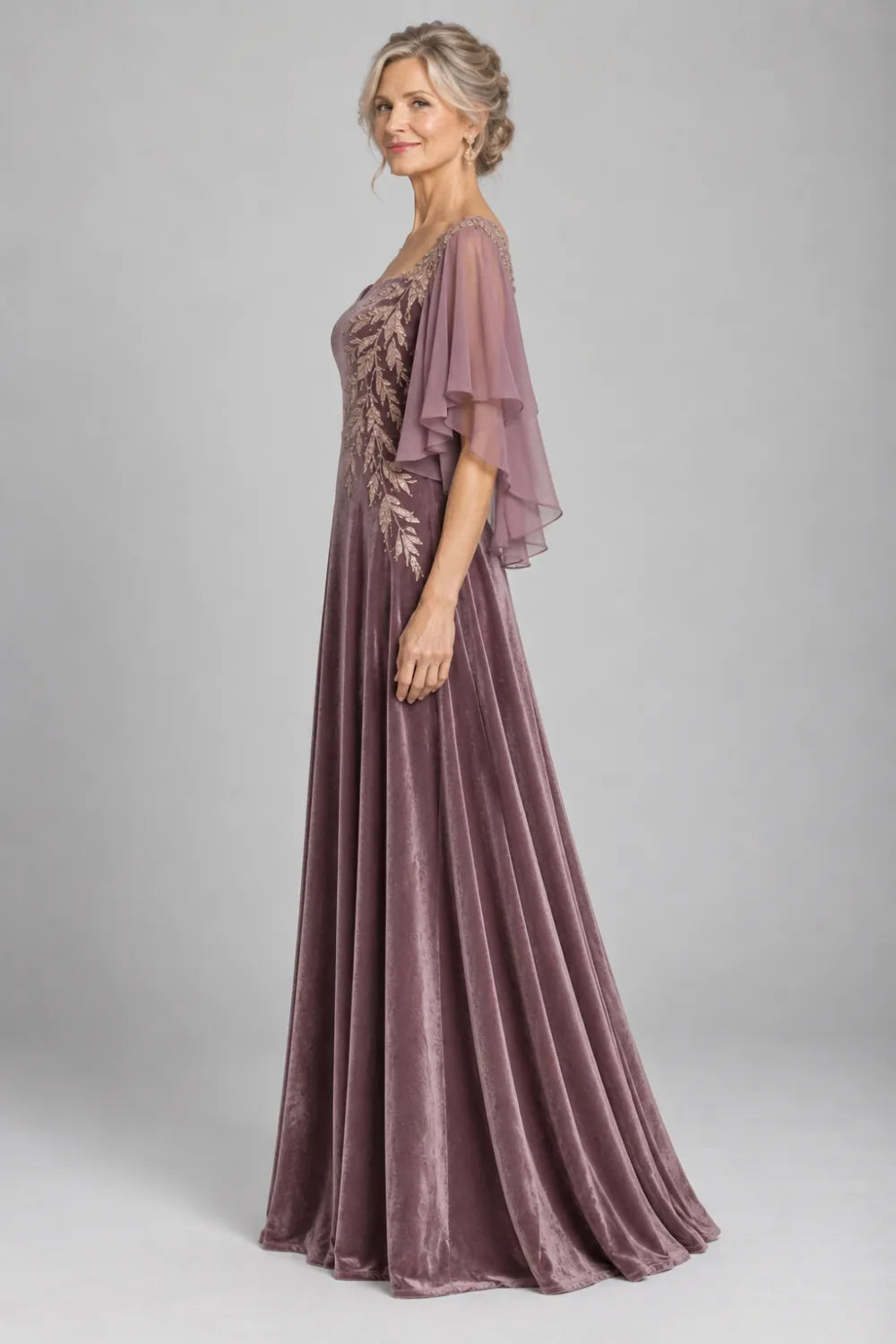 Mauve dress with diagonal gold-tone leaf embroidery, side view.