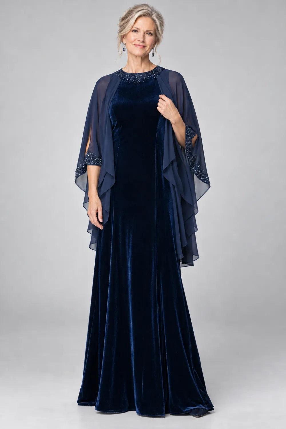 Navy Blue dress with beaded round neckline and cascading sheer cape, front view.