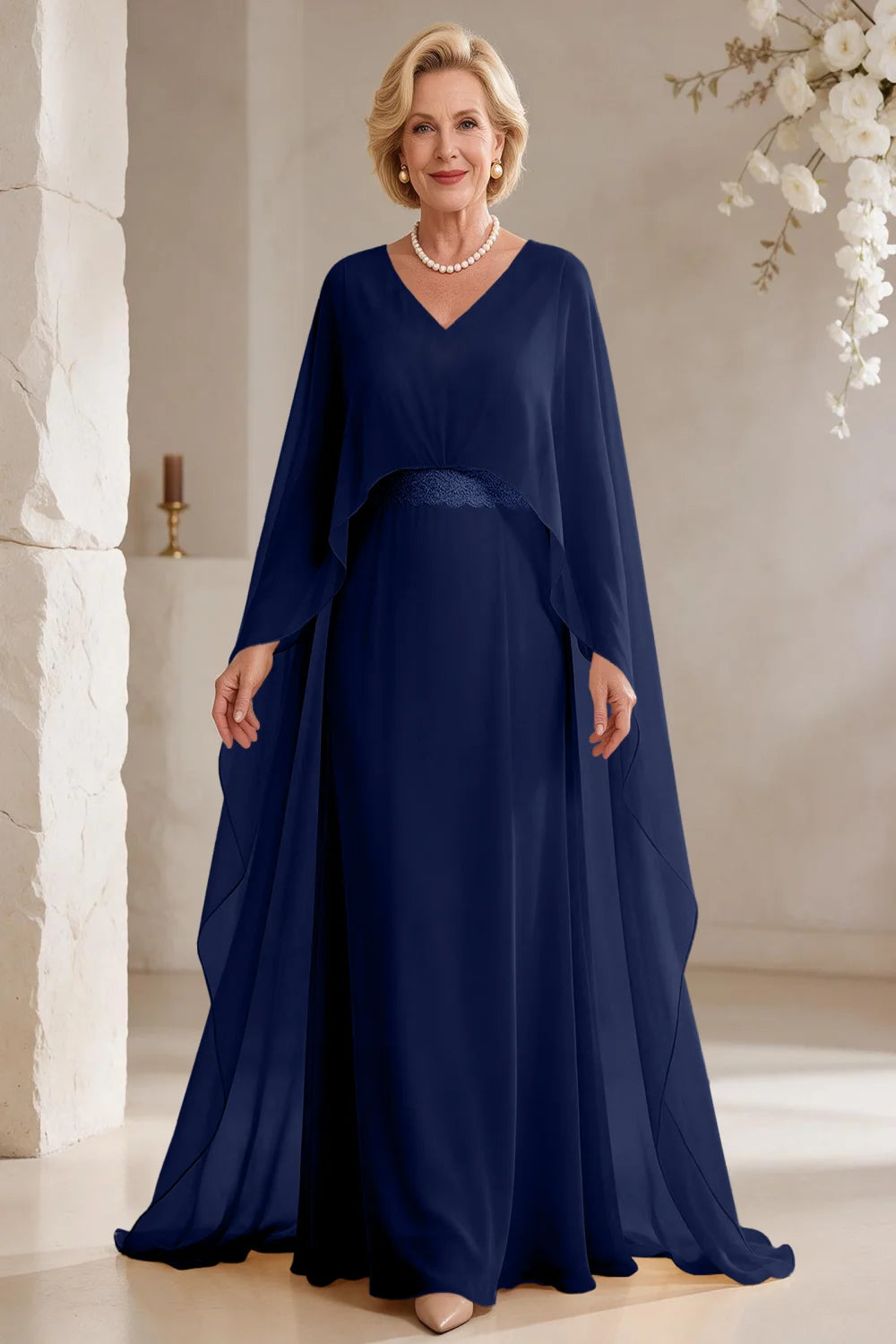 Front view of a navy blue dress with long cape panels and a flared skirt.