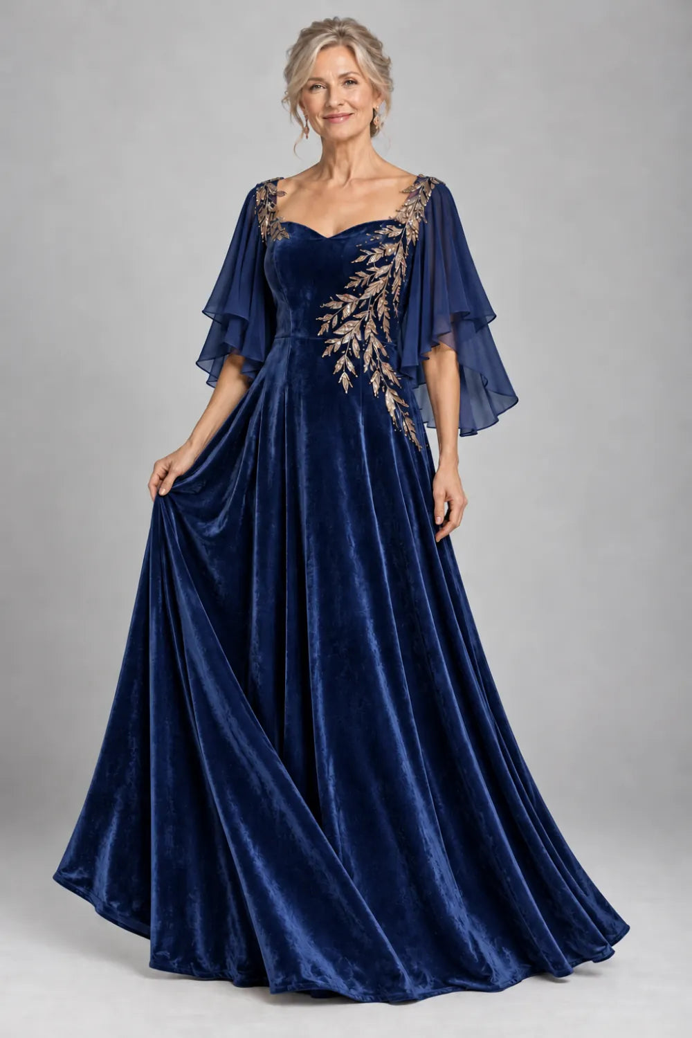 Navy Blue dress with diagonal gold-tone leaf embroidery, front view.