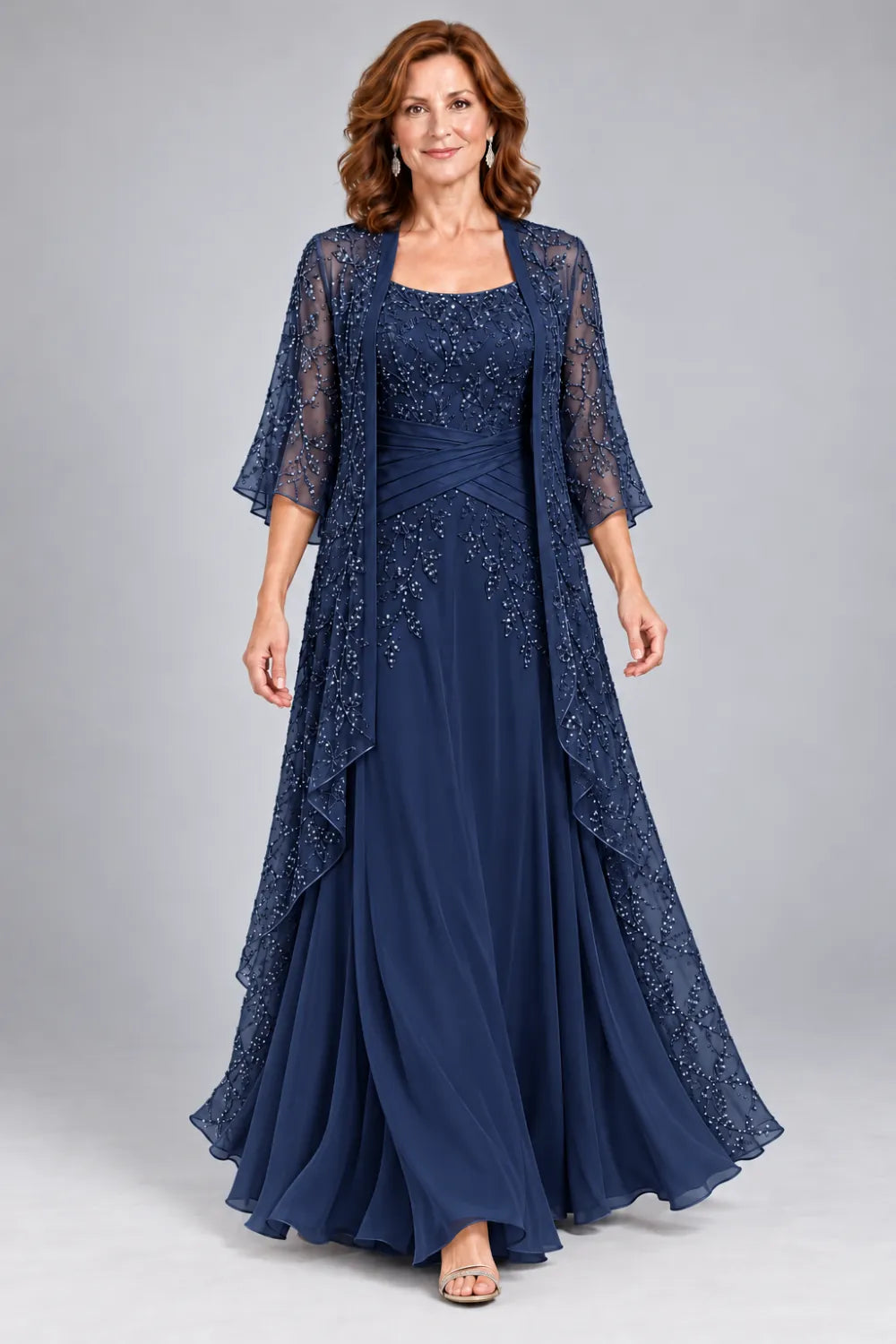 Navy Blue dress with lace bodice, diagonal waist gathers and cascading skirt panel, front view.