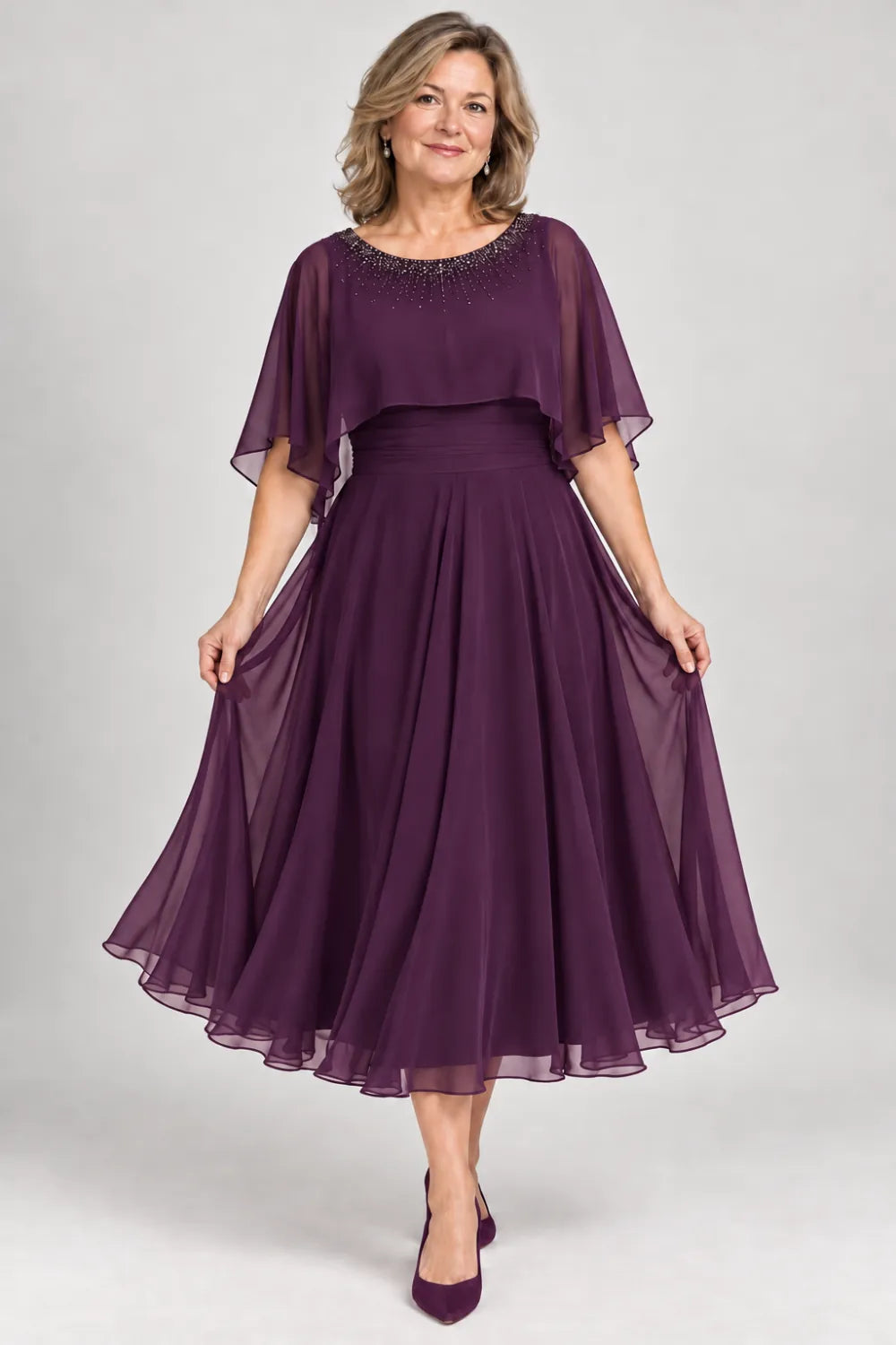 Plum dress with narrow beaded neckline and defined waist, front view.