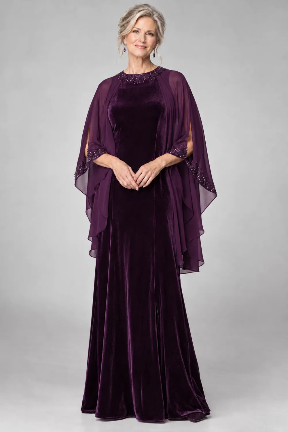 Plum dress with beaded round neckline and cascading sheer cape, front view.