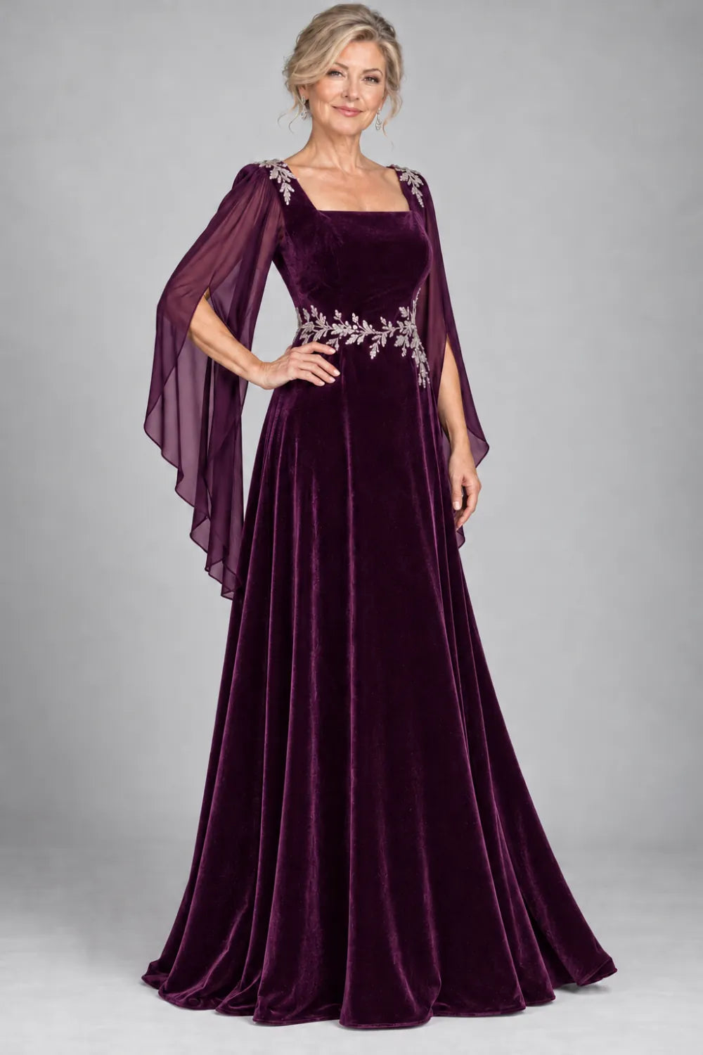 Plum dress with silver-tone leafy waist and shoulder accents, front view.