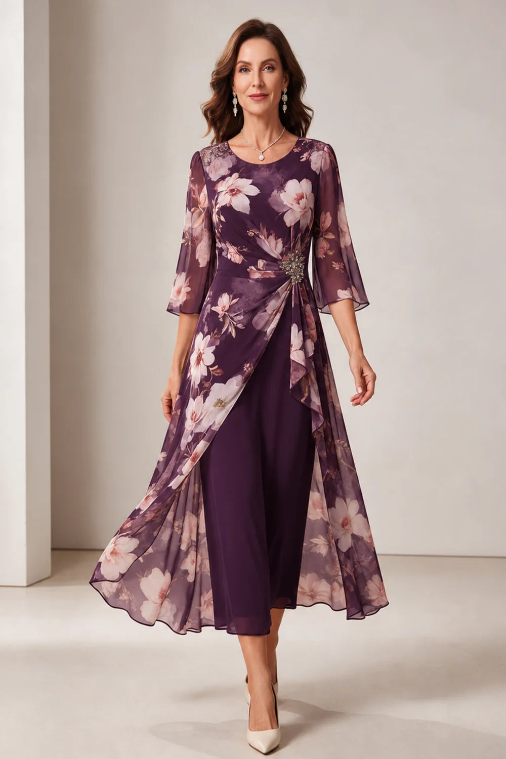 Front view of a purple dress with a floral overlay and flared sleeves.