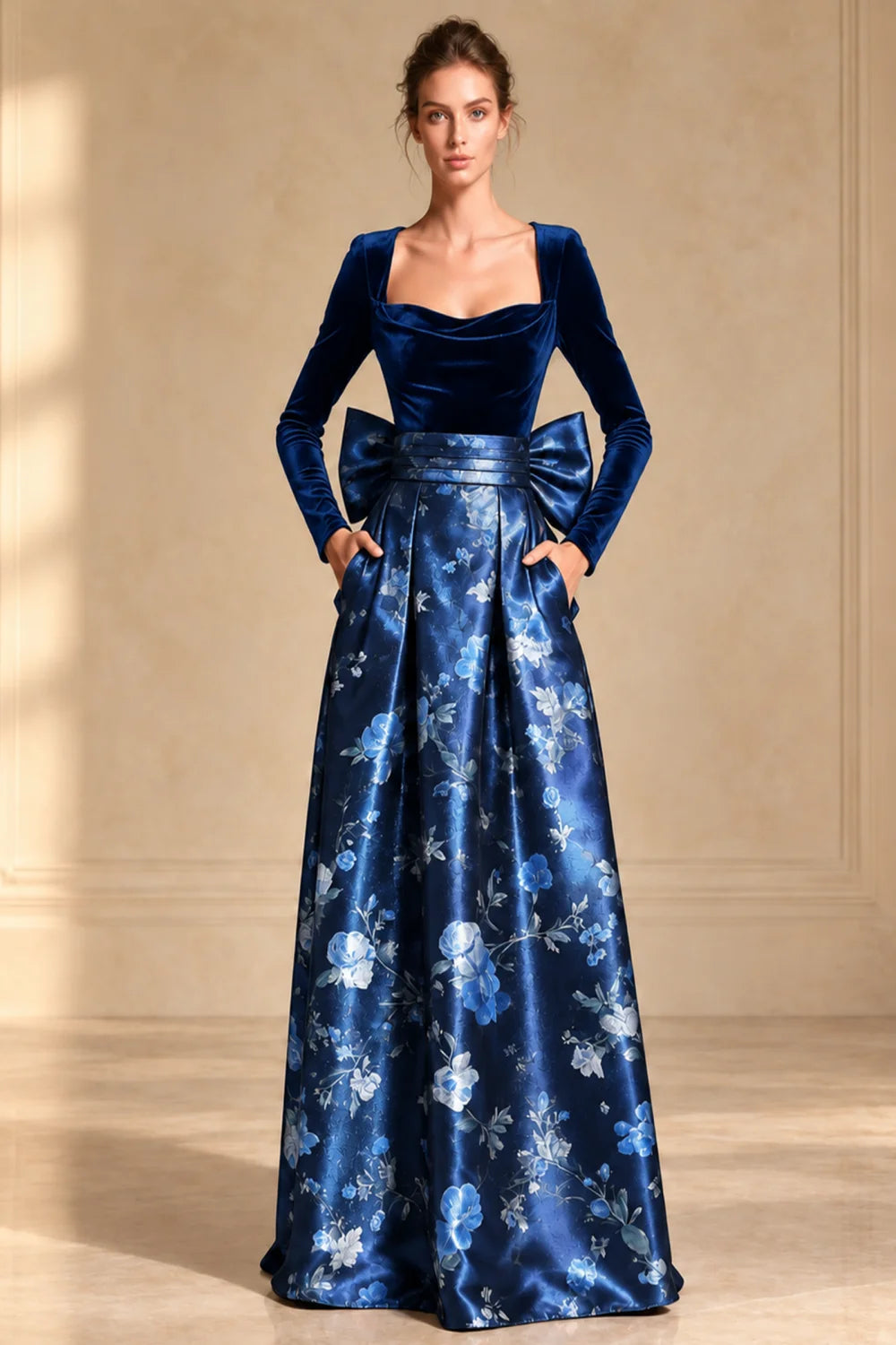 Front view of a royal blue dress with a dark bodice and full floral skirt.