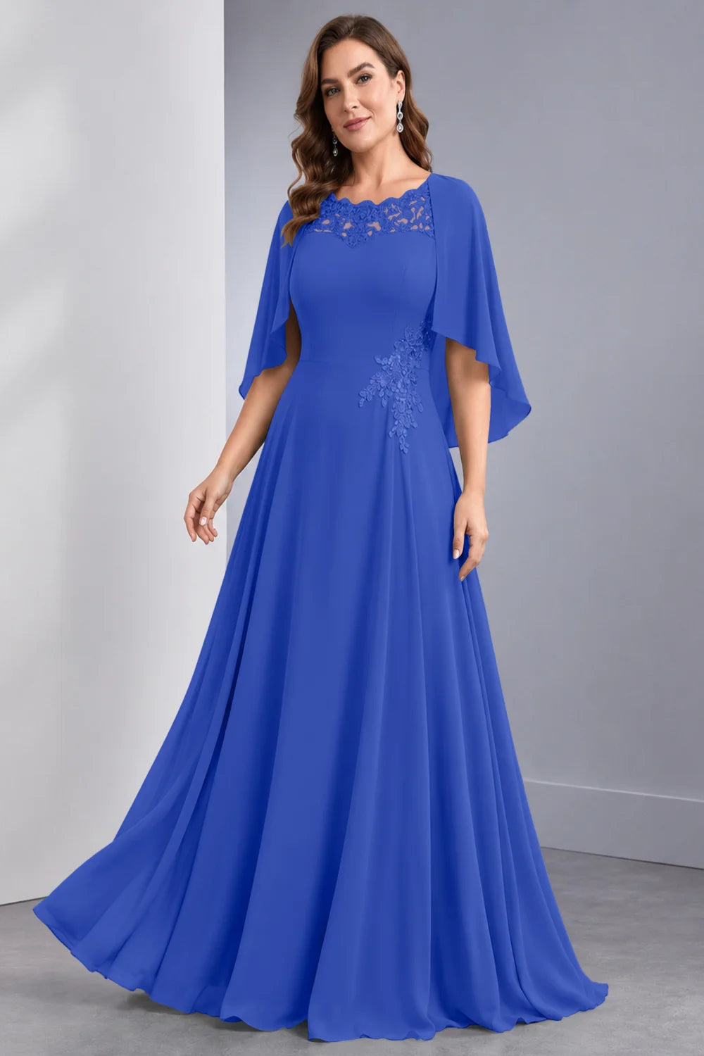 Front view of a royal blue dress with draped sleeve panels and a lace neckline.