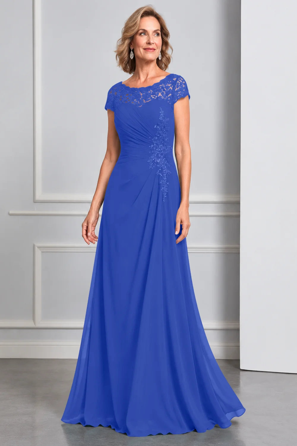 Front view of a royal blue dress with lace cap sleeves and side waist decoration.