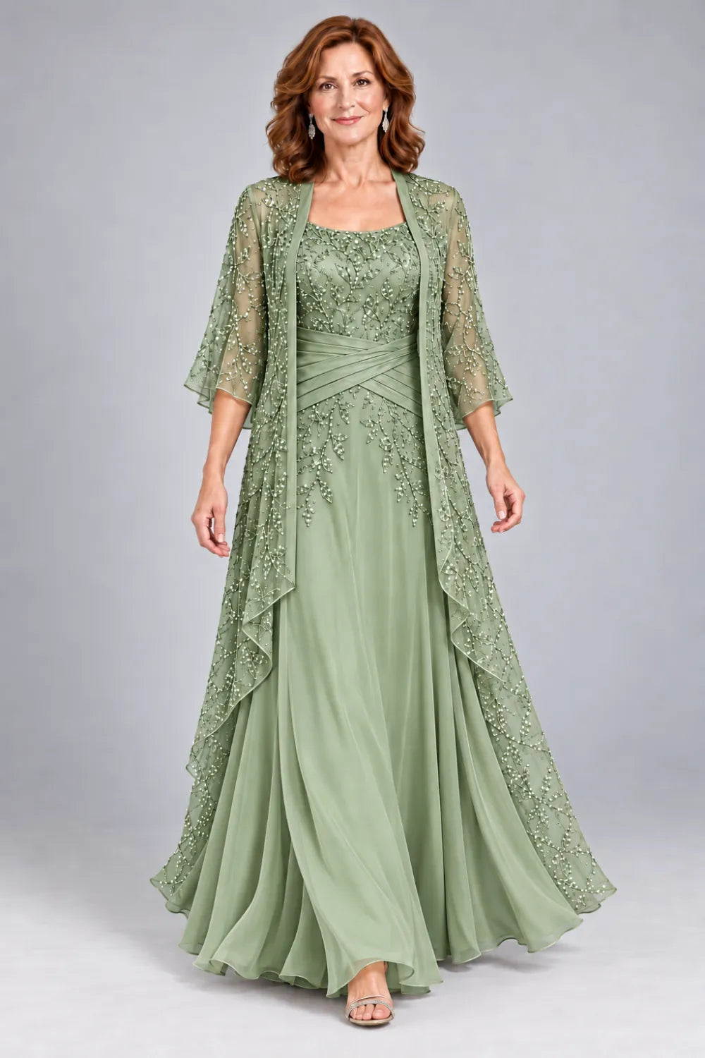 Sage Green dress with lace bodice, diagonal waist gathers and cascading skirt panel, front view.