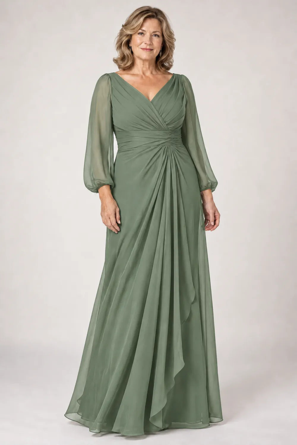 Sage Green dress with crossover bodice, gathered waist and cascading side panel, front view.