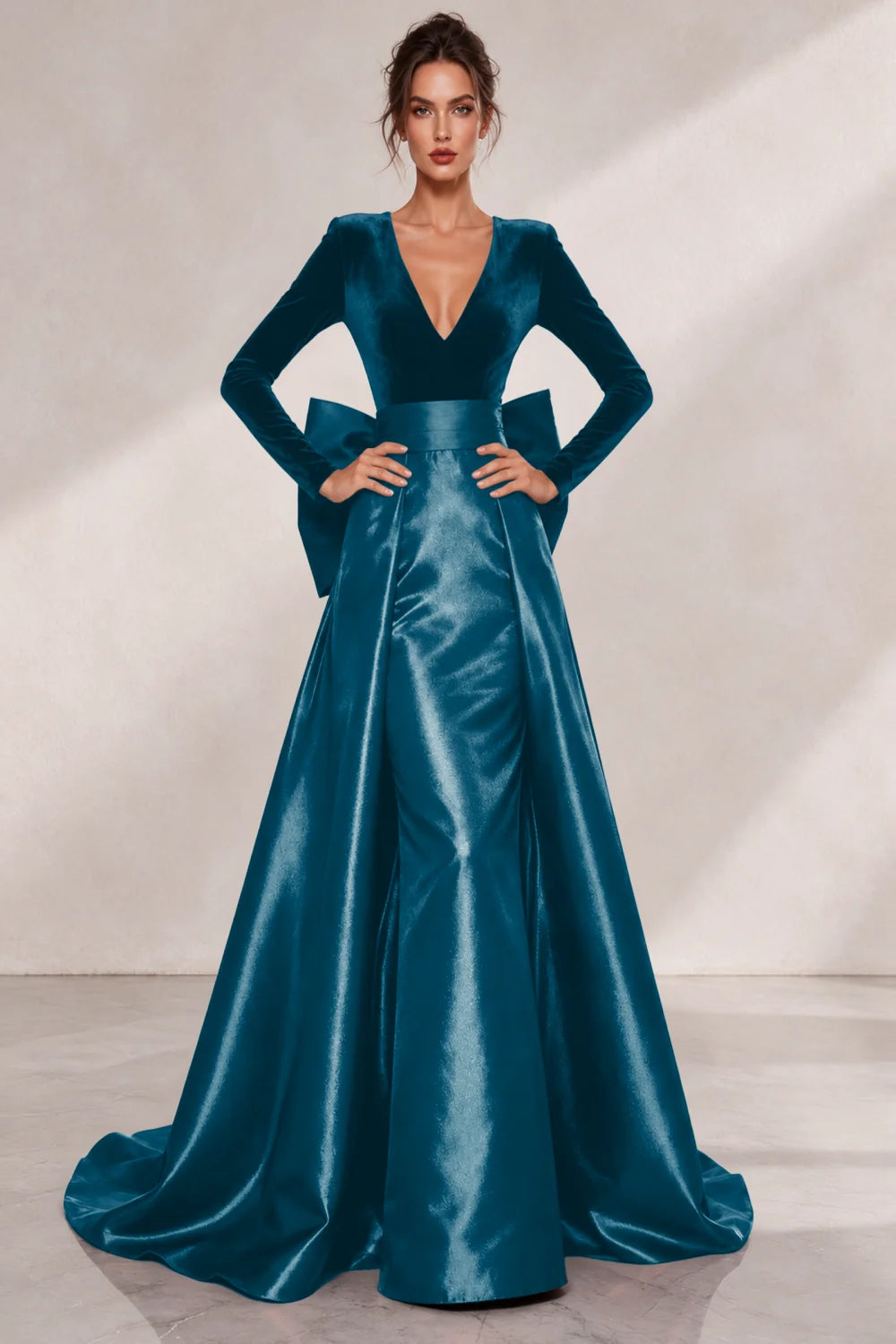 Front view of a teal blue dress with a V neckline and a lustrous full skirt.