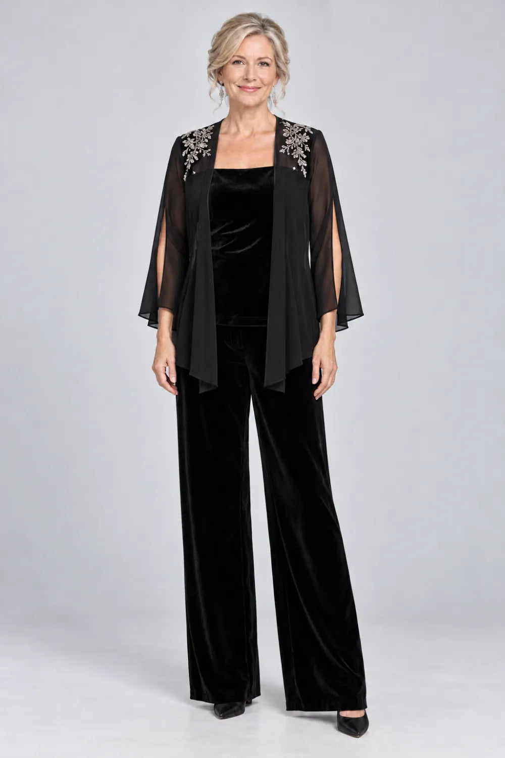 Black pant suit with floral shoulder embroidery and square-neck top, front view.