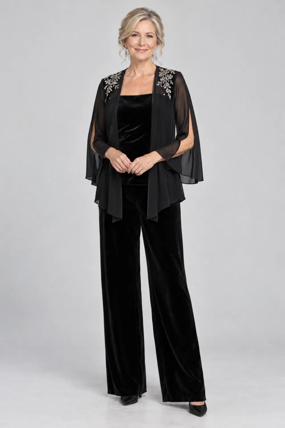 Black pant suit with floral shoulder embroidery and square-neck top, front view.