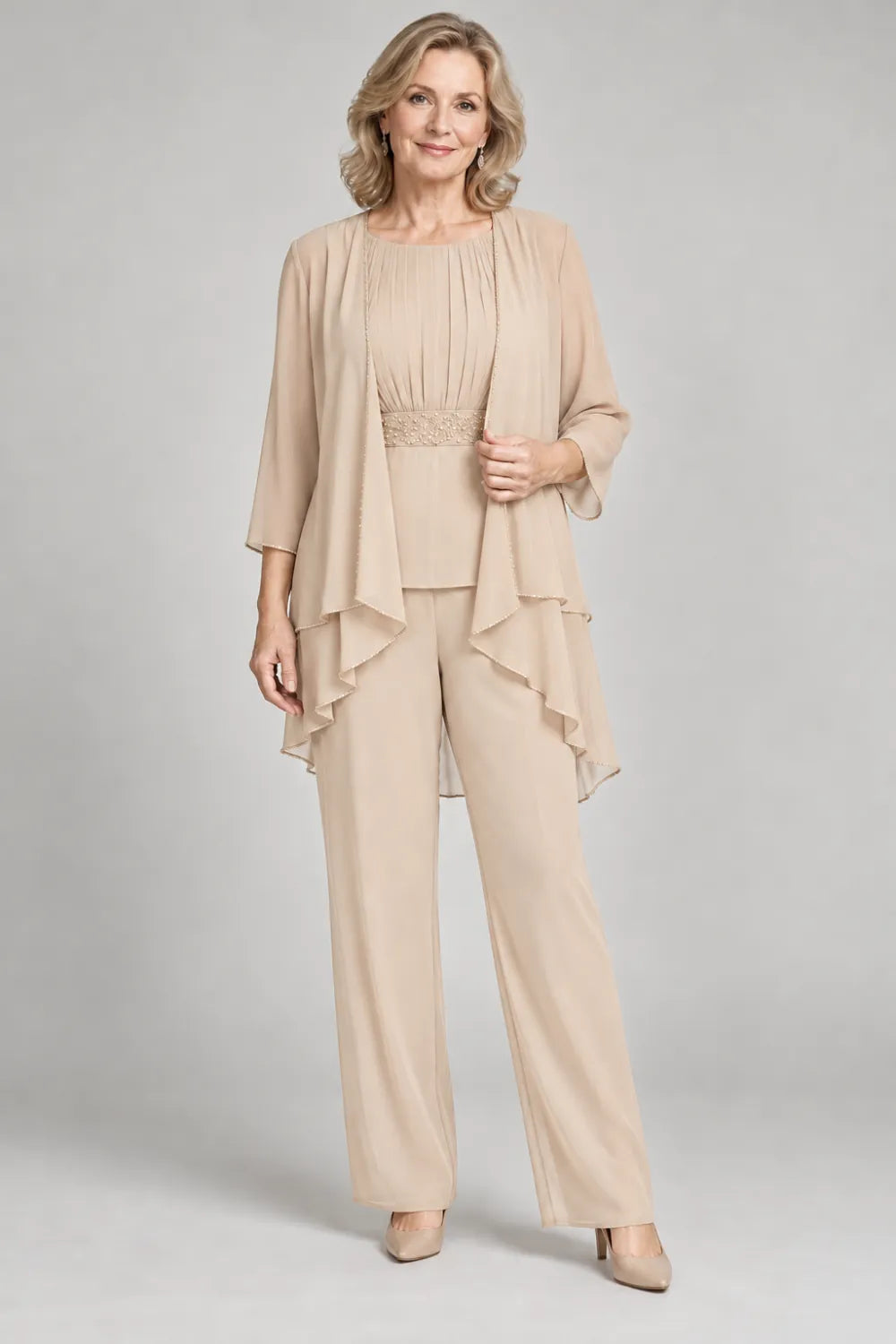 Champagne pant suit with gathered top and decorated horizontal waist band, front view.
