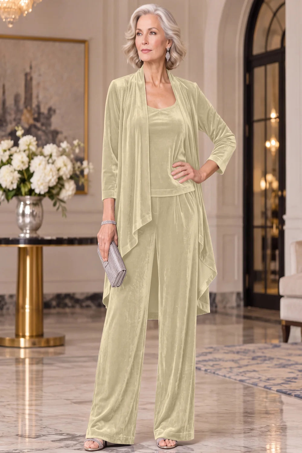Front view of a champagne pant suit with a long waterfall jacket and wide-leg trousers.