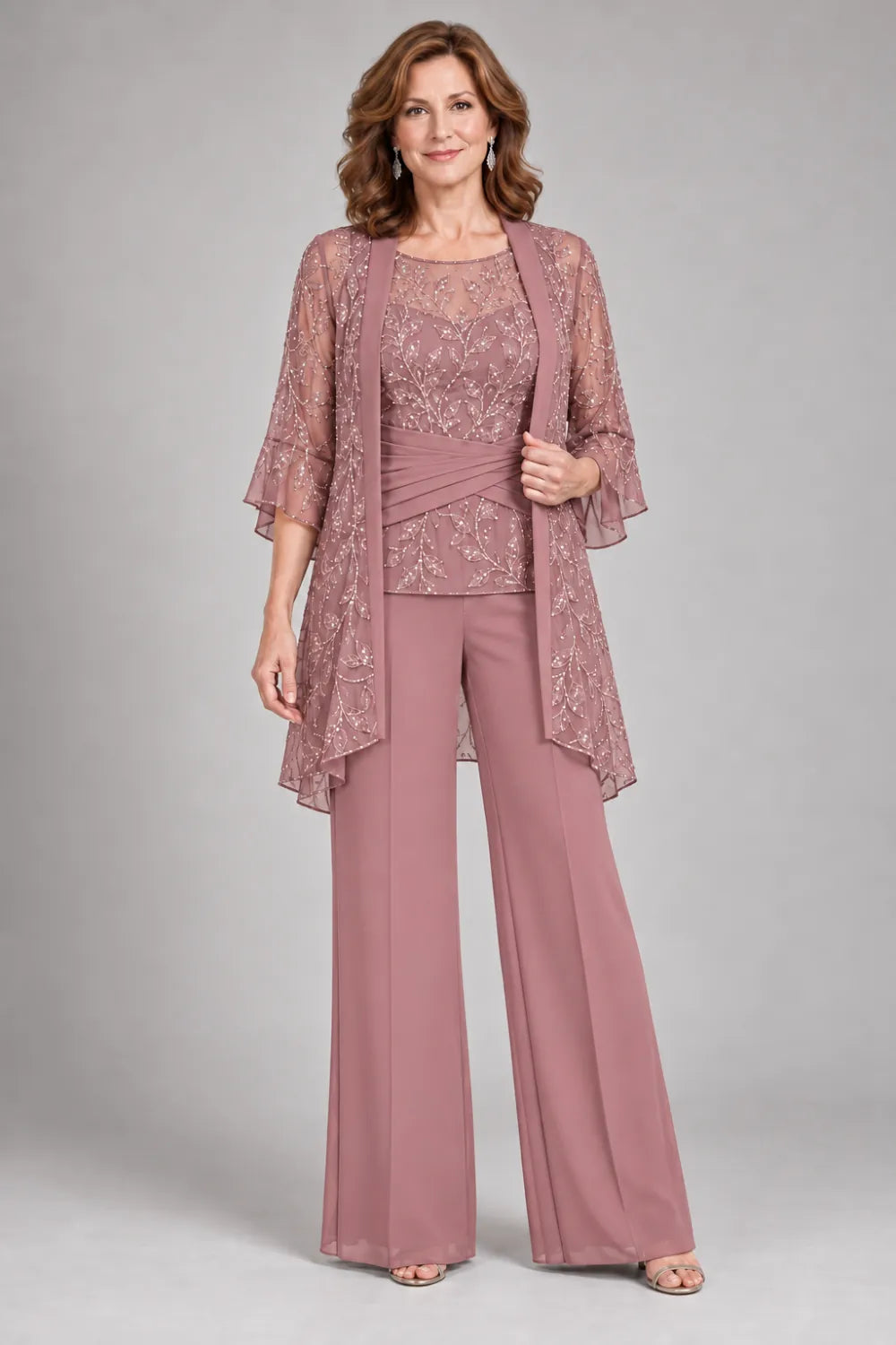 Dusty Rose pant suit with floral lace top and diagonal gathered waist, front view.