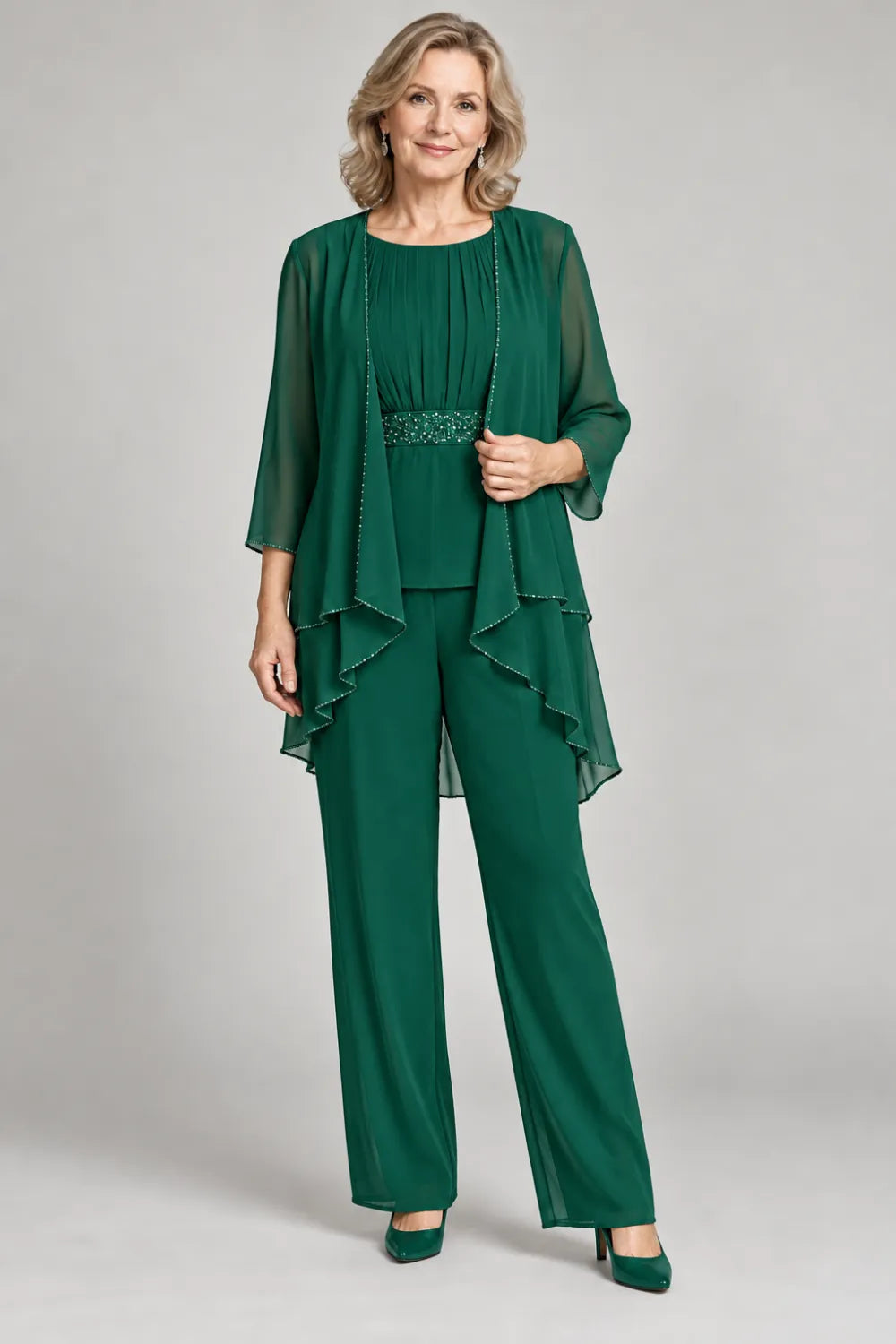 Emerald Green pant suit with gathered top and decorated horizontal waist band, front view.