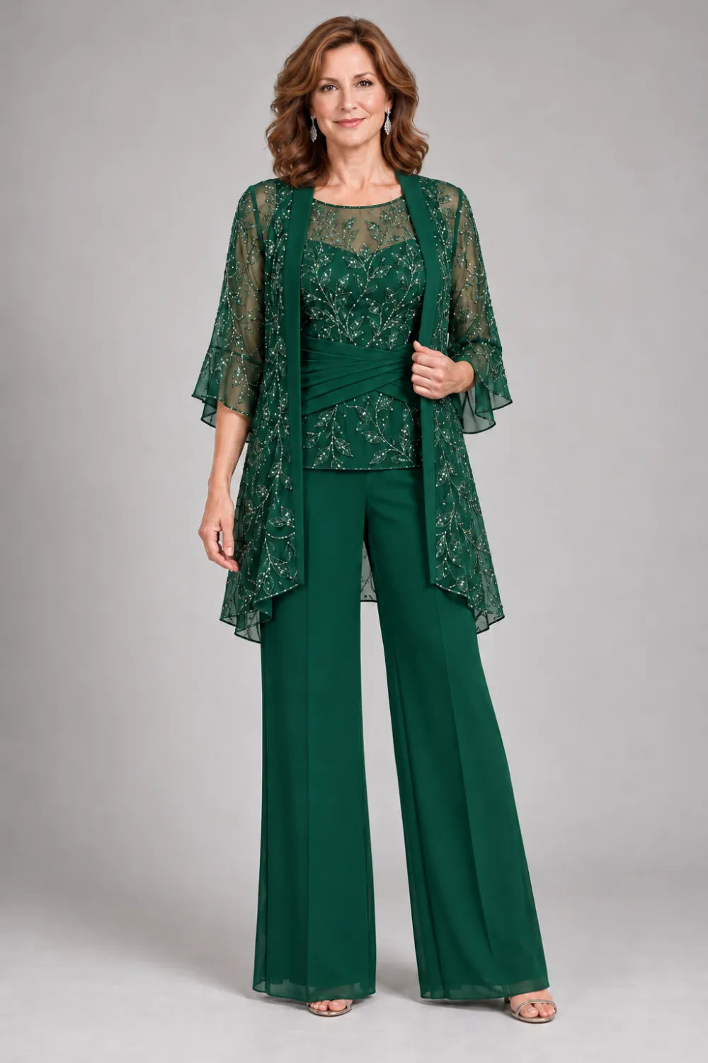 Emerald Green pant suit with floral lace top and diagonal gathered waist, front view.