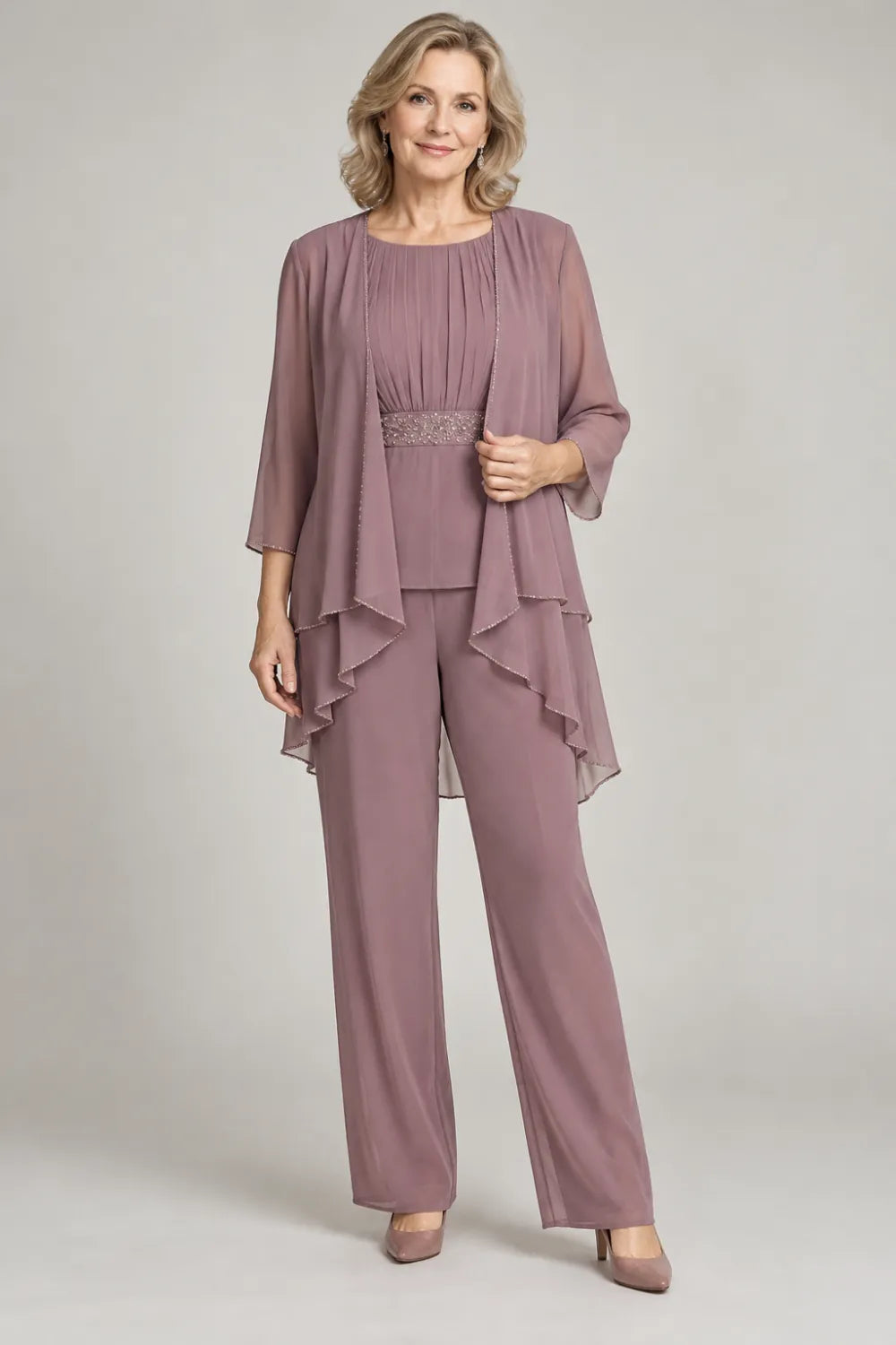 Mauve pant suit with gathered top and decorated horizontal waist band, front view.