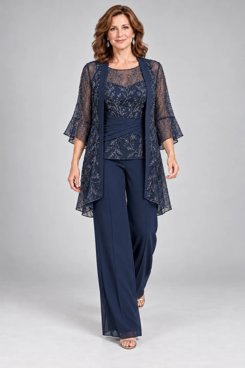Navy Blue pant suit with floral lace top and diagonal gathered waist, front view.