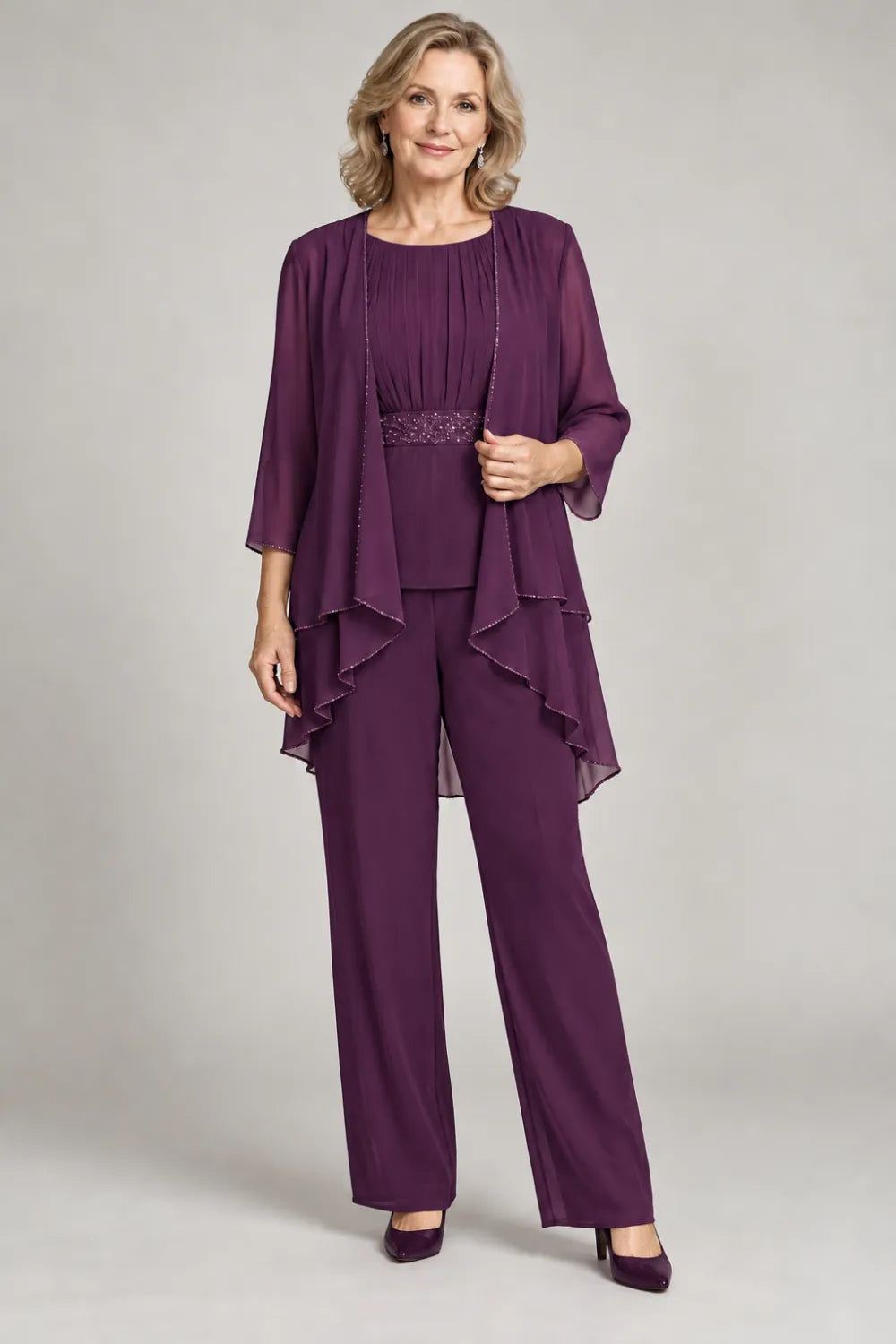 Plum pant suit with gathered top and decorated horizontal waist band, front view.