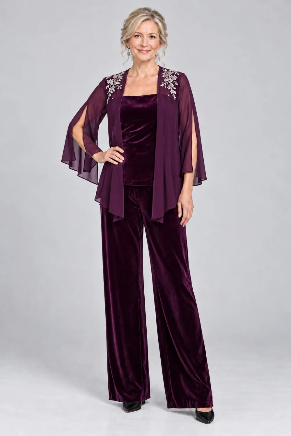 Plum pant suit with floral shoulder embroidery and square-neck top, front view.