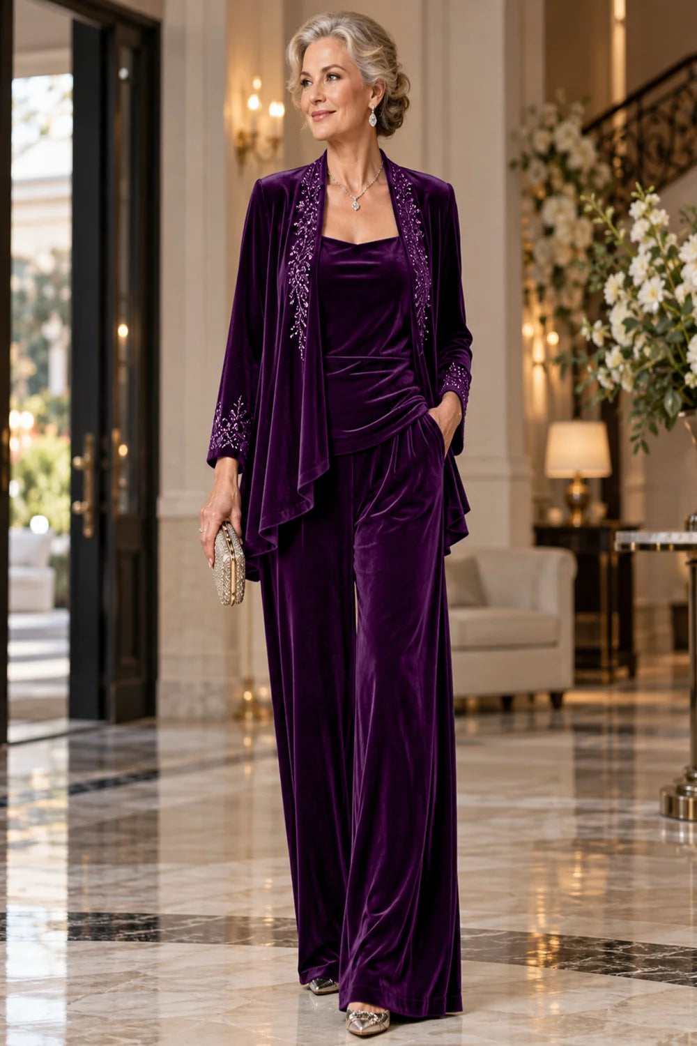 Front view of a purple pant suit with an embellished jacket and matching trousers.