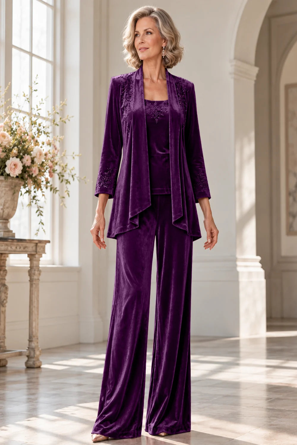 Front view of a purple pant suit with a waterfall jacket and matching trousers.