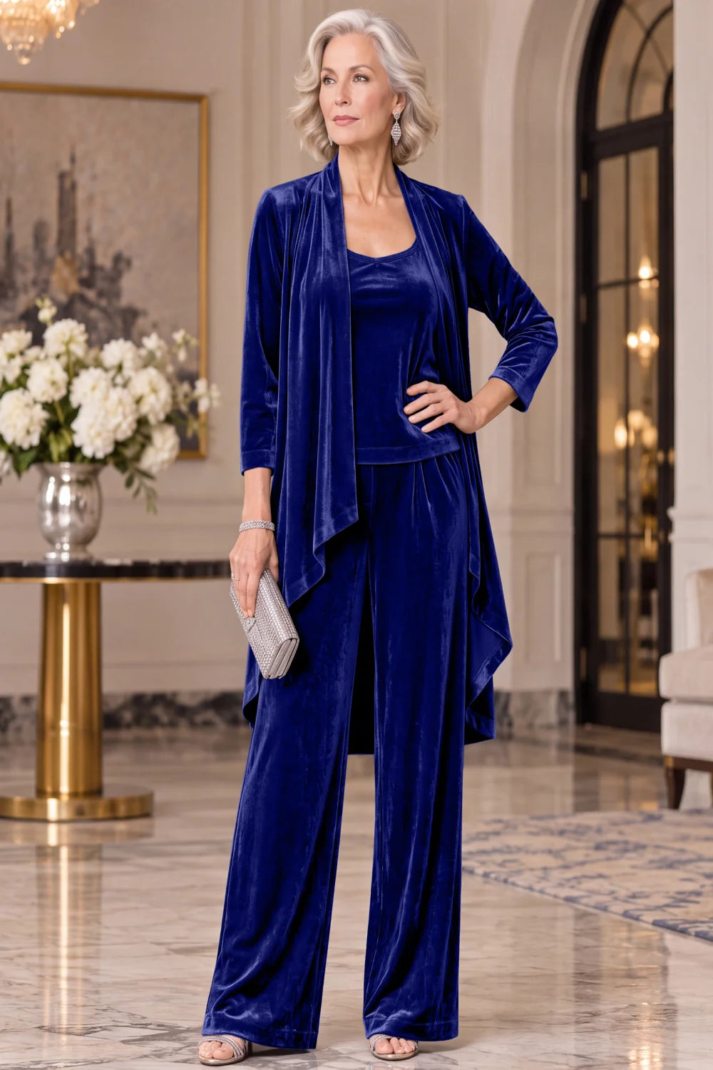 Front view of a royal blue pant suit with a long waterfall jacket and wide-leg trousers.