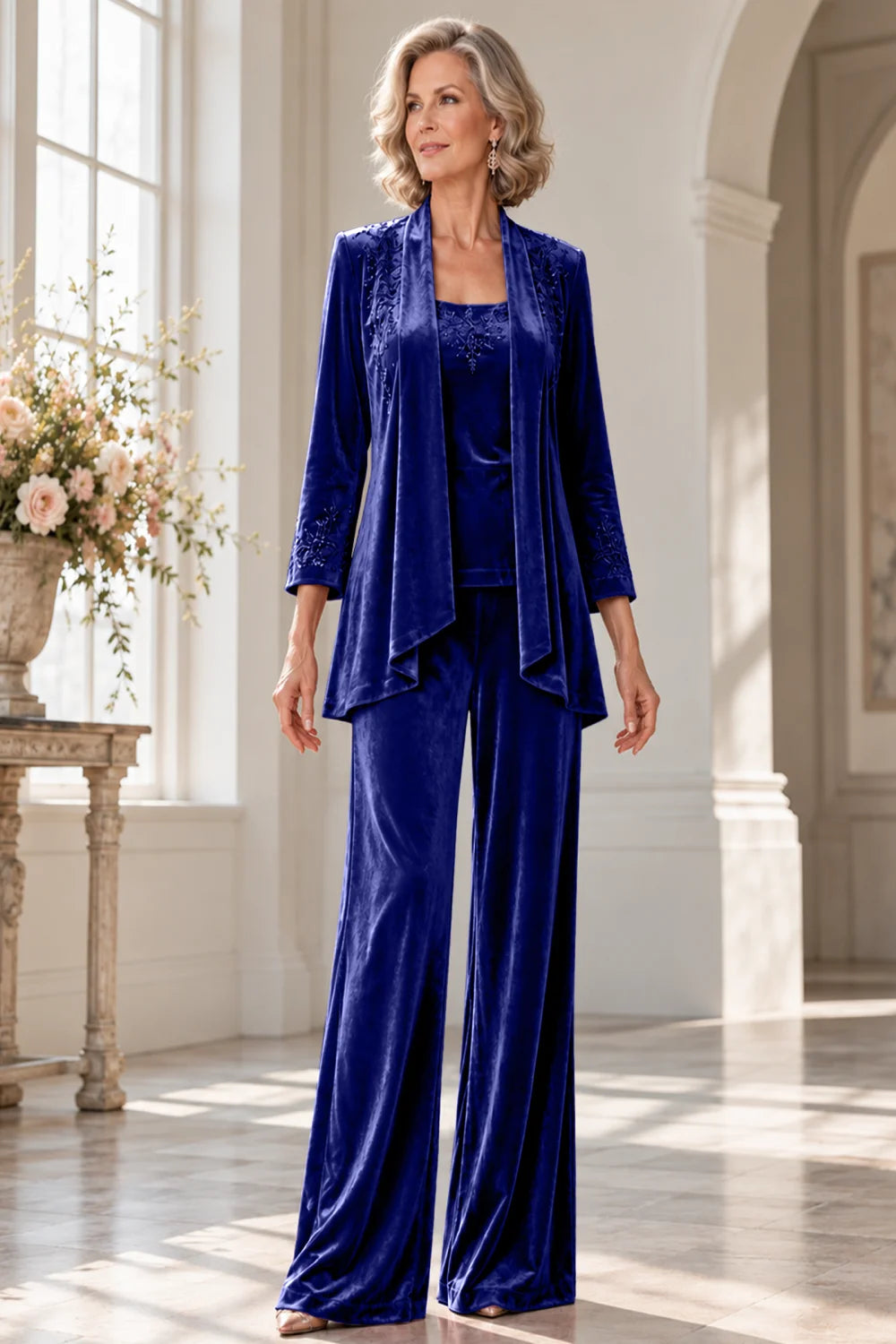 Front view of a royal blue pant suit with a waterfall jacket and matching trousers.