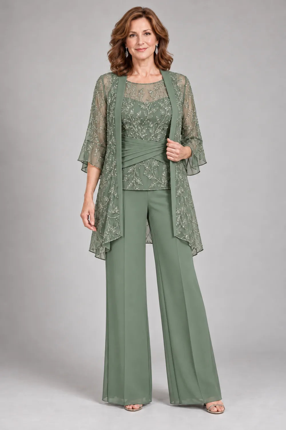 Sage Green pant suit with floral lace top and diagonal gathered waist, front view.