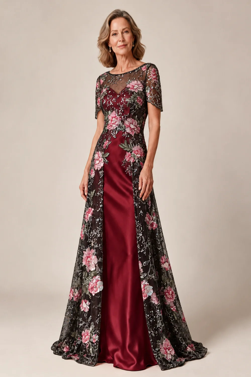 Front view of a black burgundy dress with a floral overlay and plain inner skirt.