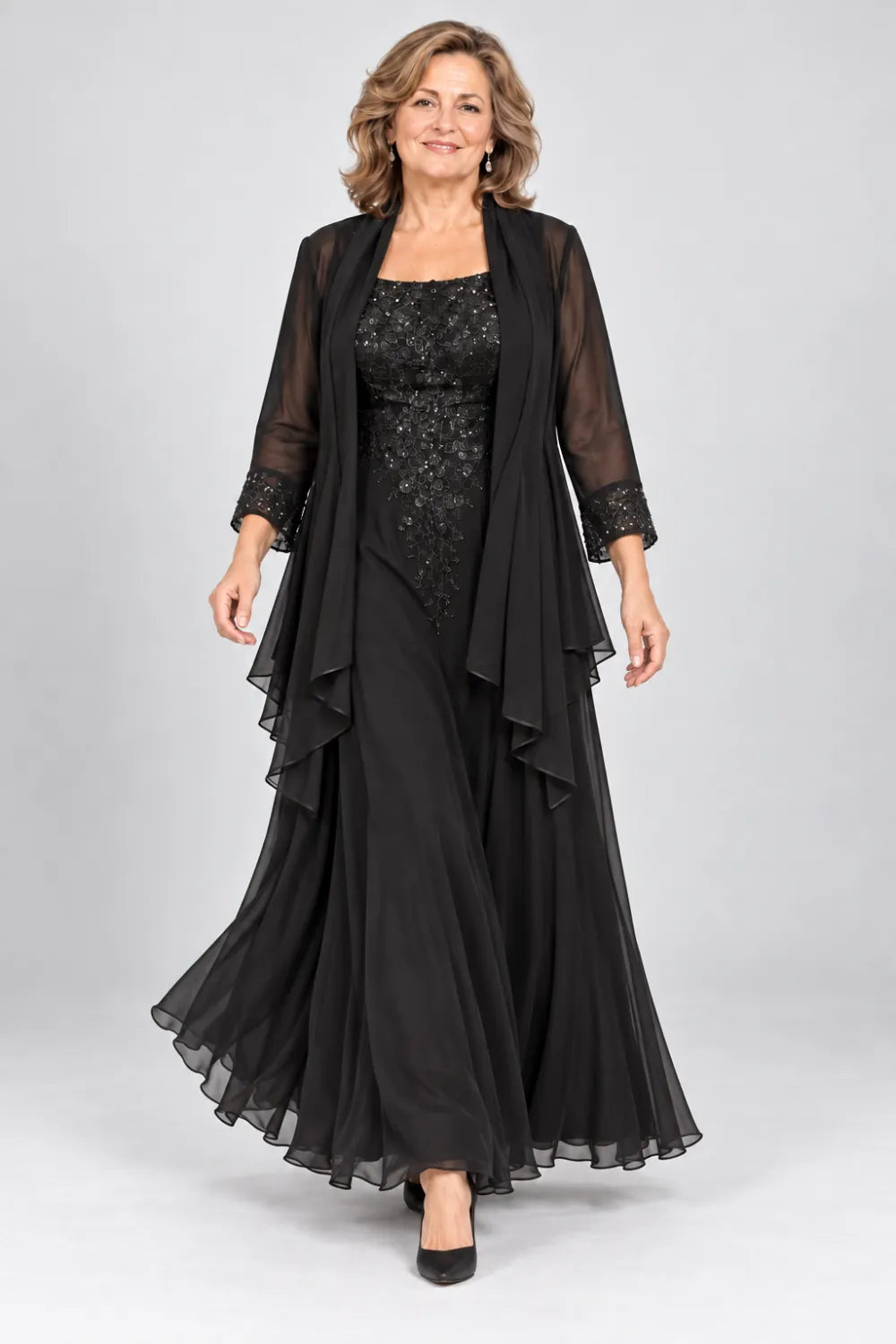 Black dress with floral bodice and matching decorated cuffs, posed front view.