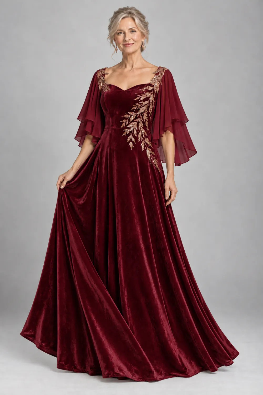Burgundy dress with diagonal gold-tone leaf embroidery, front view.
